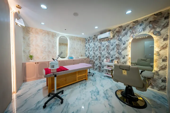 A marble-floored consultation and treatment room at Hiwaga Tirupati