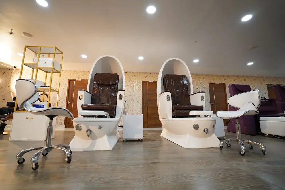 Pedicure chairs and stools at the Hiwaga Vijayawada salon